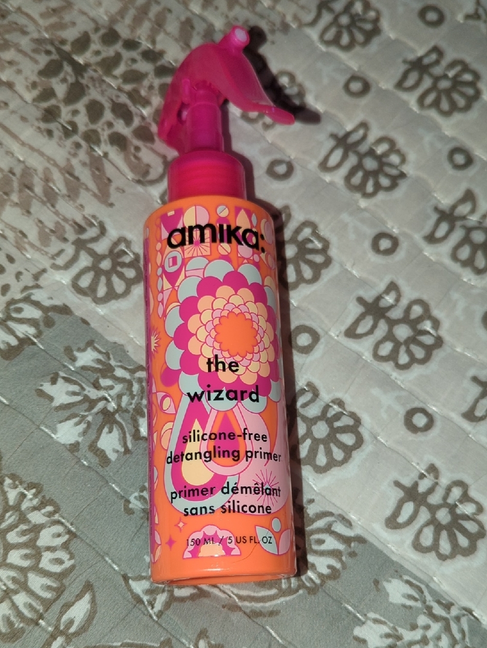 amika Detangling Primer in Pink and Orange